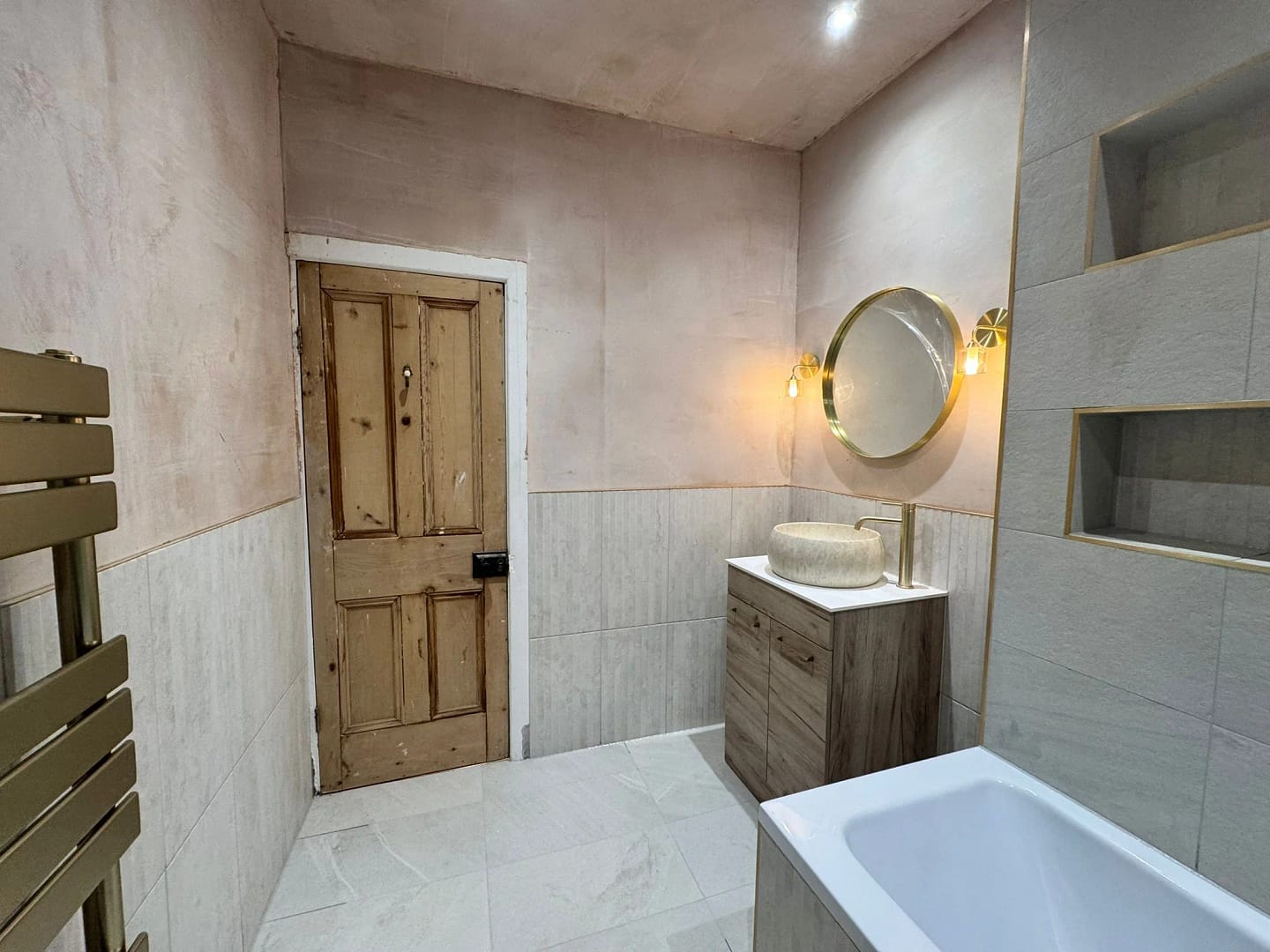Refurbished bathroom 3 showing doorway, vanity unit with sink and mirror over