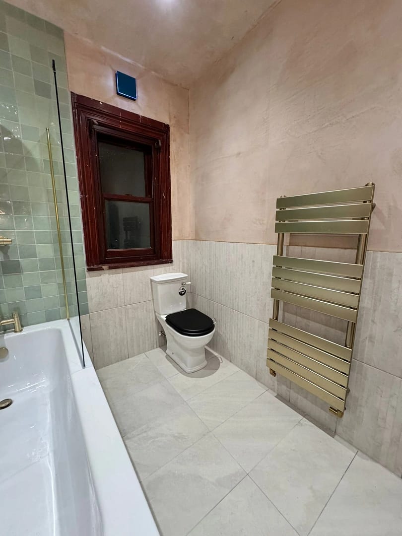 Refurbished bathroom 3 showing new towel rail and WC