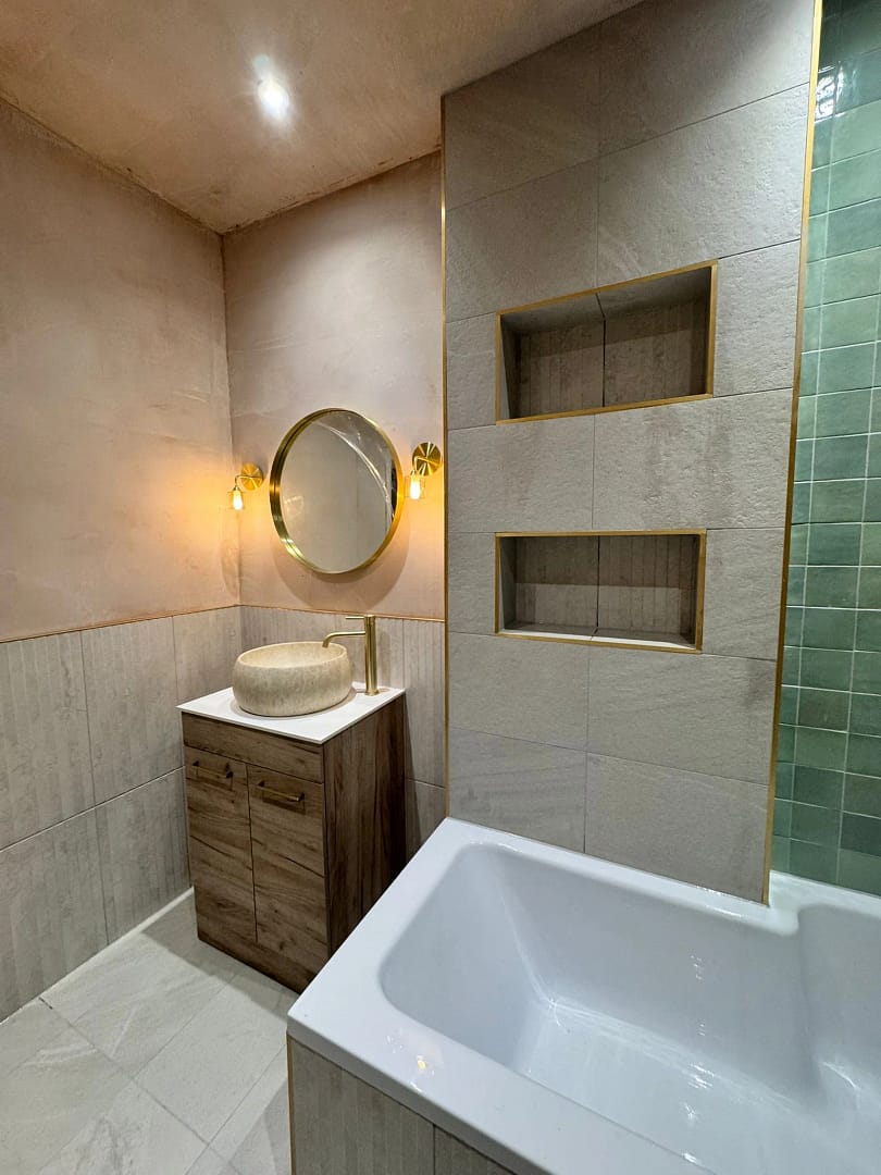 Refurbished bathroom 3 showing vanity unit, mirror, inset shelving in tiles